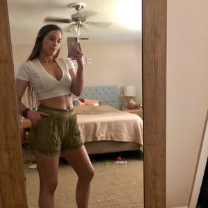 Camo green, high-waisted shorts detailed with lace